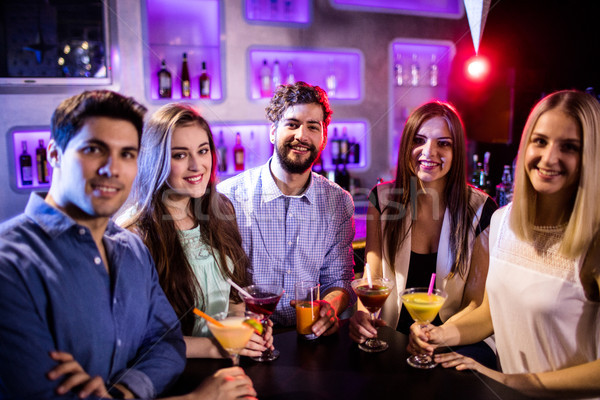 Groupe amis cocktail bar contre portrait [[stock_photo]] © wavebreak_media