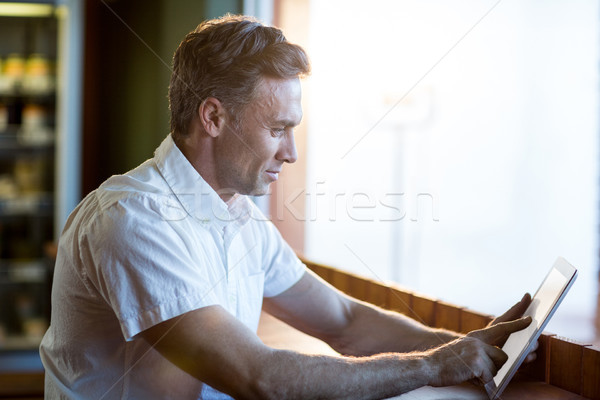 Man using digital tablet in cafÃ© Stock photo © wavebreak_media