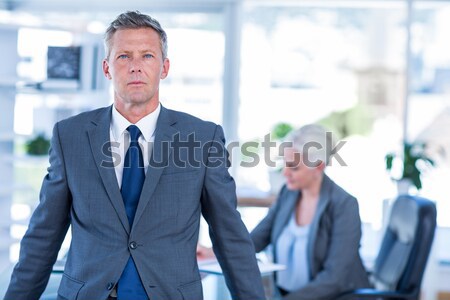Smiling businessman standing with arms crossed Stock photo © wavebreak_media