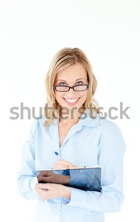 Smiling businesswoman wearing glasses and holding a clipboard Stock photo © wavebreak_media