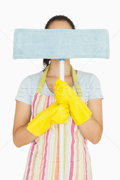 Young woman hiding behind blue mop  Stock photo © wavebreak_media