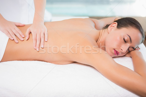 Stock photo: Attractive woman receiving back massage at spa center