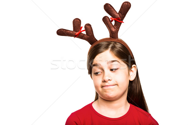 Festive little girl wearing antlers Stock photo © wavebreak_media