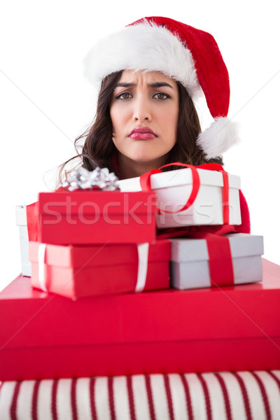 Confused brunette holding pile of gifts Stock photo © wavebreak_media
