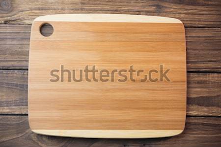 Chopping board on wooden table Stock photo © wavebreak_media