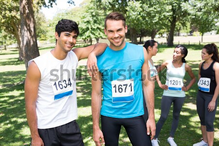 Composite image of portrait of cheerful volunteer in office  Stock photo © wavebreak_media