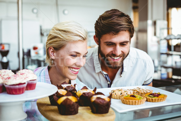 Cute couple on a date looking at cakes Stock photo © wavebreak_media