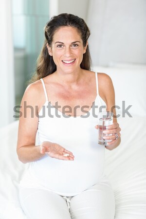 Smiling sporty woman doing yoga Stock photo © wavebreak_media