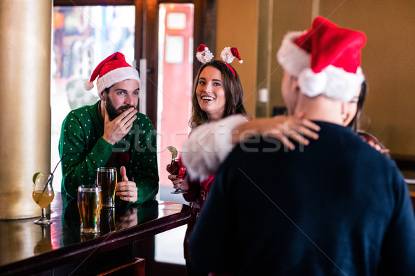 Festive friends in a bar Stock photo © wavebreak_media