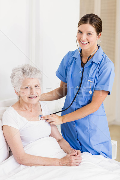 A smiling nurse with her patient Stock photo © wavebreak_media
