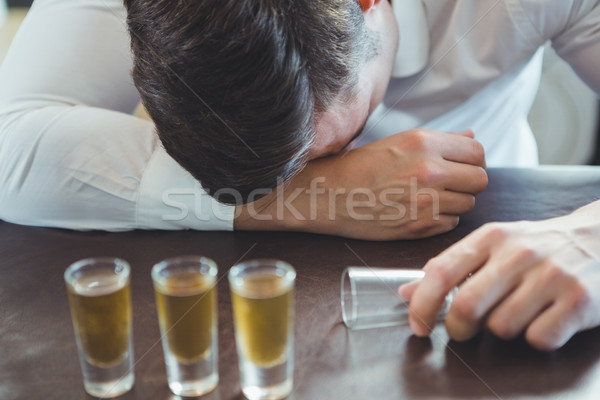 Drunken man sleeping on a bar counter Stock photo © wavebreak_media