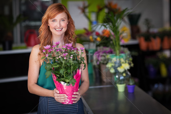 Female florist holding flower bouquet at flower shop Stock photo © wavebreak_media