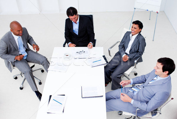 Stock photo: High angle of a smiling business team in a meeting