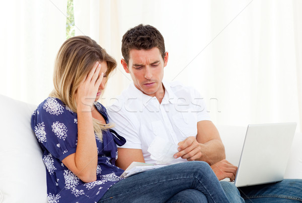 Distressed couple angry with so many bills to pay Stock photo © wavebreak_media