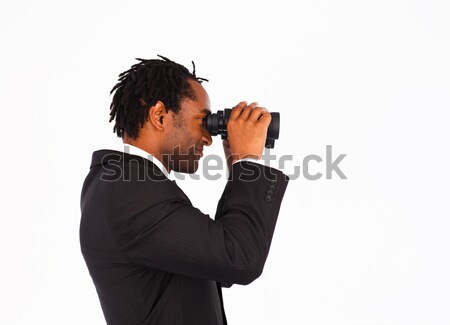 Sidewise closeup of a cute businessman with binoculars Stock photo © wavebreak_media