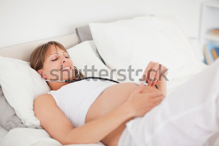 Man sleeping on his bed Stock photo © wavebreak_media