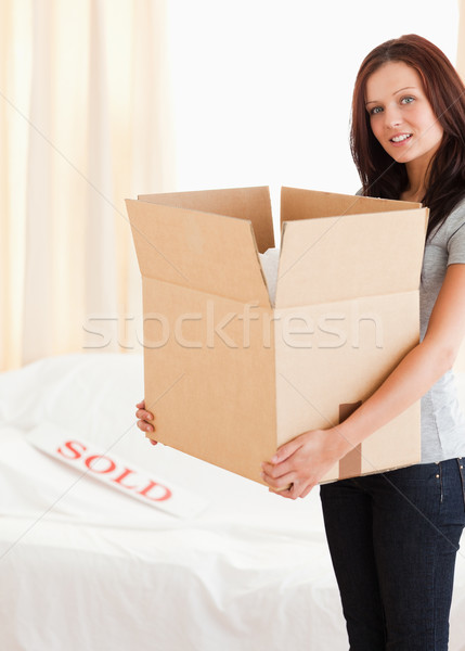 A female with a cardboard Stock photo © wavebreak_media