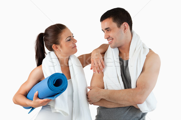 Healthy couple going to practice yoga against a white background Stock photo © wavebreak_media