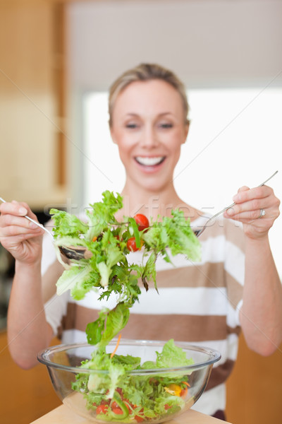 Salad being stirred by smiling woman Stock photo © wavebreak_media