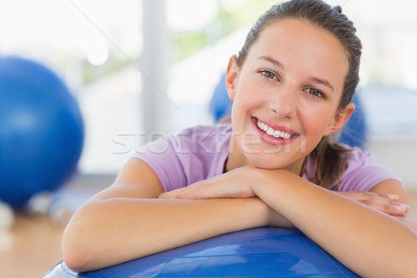 Stock photo: Portrait of a fit woman with exercise ball