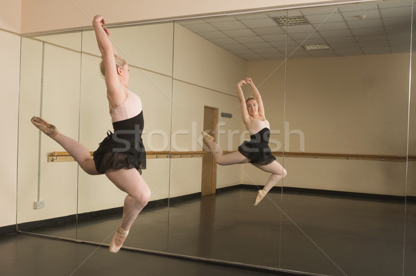 Beautiful ballerina dancing in front of mirror Stock photo © wavebreak_media