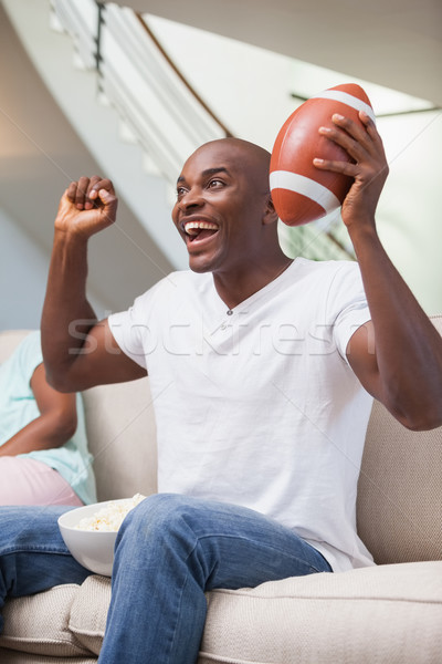 Nudzić kobieta posiedzenia chłopak oglądania sportu Zdjęcia stock © wavebreak_media