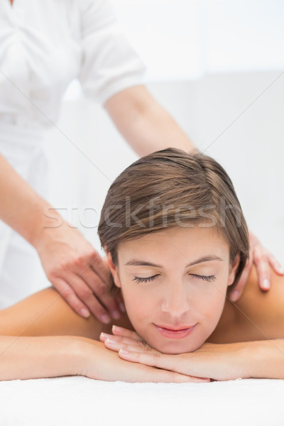 Attractive woman receiving shoulder massage at spa center Stock photo © wavebreak_media