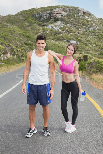 Portrait of a fit couple standing on road Stock photo © wavebreak_media