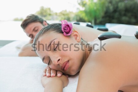 Woman lying on massage table at spa center Stock photo © wavebreak_media