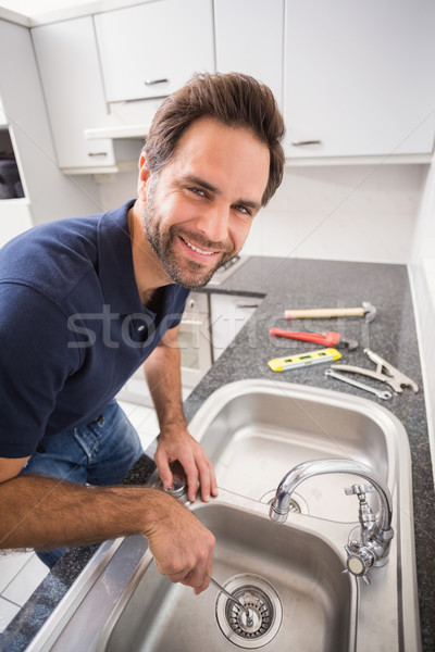 Plumber fixing sink with screwdriver Stock photo © wavebreak_media