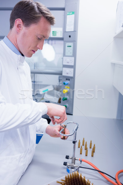 Focused biochemist sealing a vial Stock photo © wavebreak_media