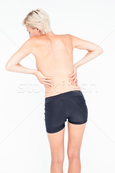 Pretty woman suffering from back pain  Stock photo © wavebreak_media