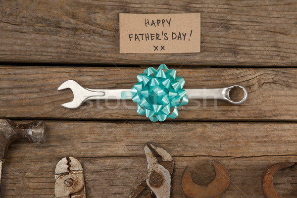 Paper with happy fathers day text by hand tools on table Stock photo © wavebreak_media