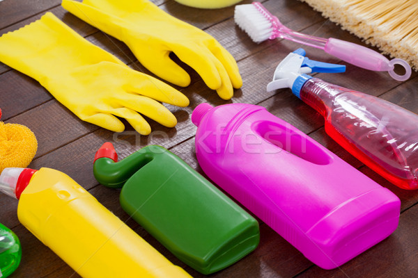 Various cleaning equipment arranged on wooden floor Stock photo © wavebreak_media