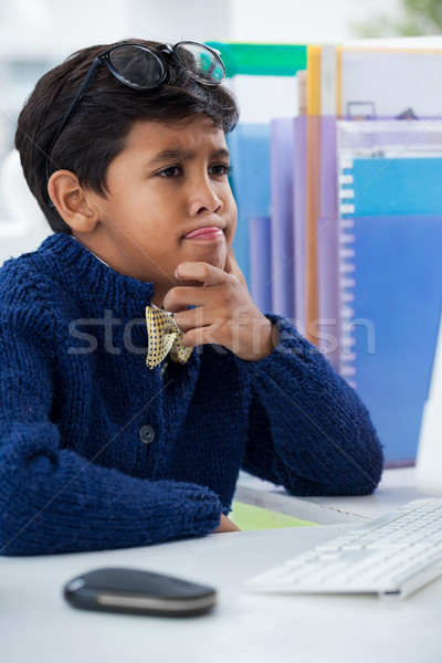 Close up of confused businessman looking at computer monitor Stock photo © wavebreak_media