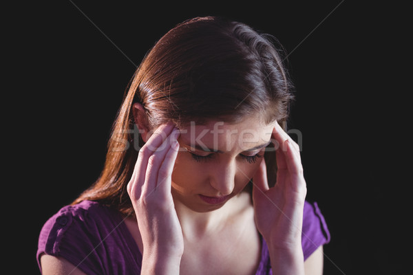 Pretty woman getting a headache Stock photo © wavebreak_media