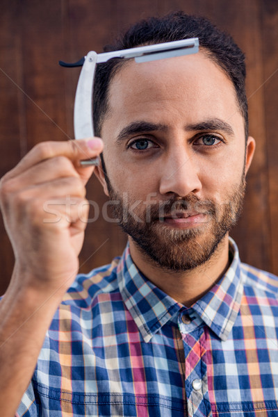Portré üzletember tart borotva áll fal Stock fotó © wavebreak_media