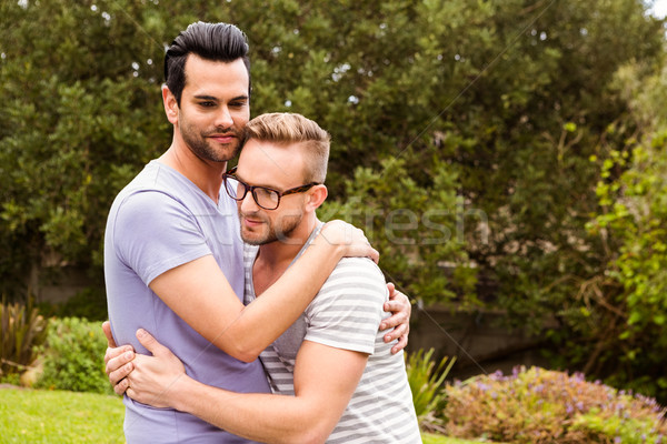 Smiling gay couple hugging  Stock photo © wavebreak_media