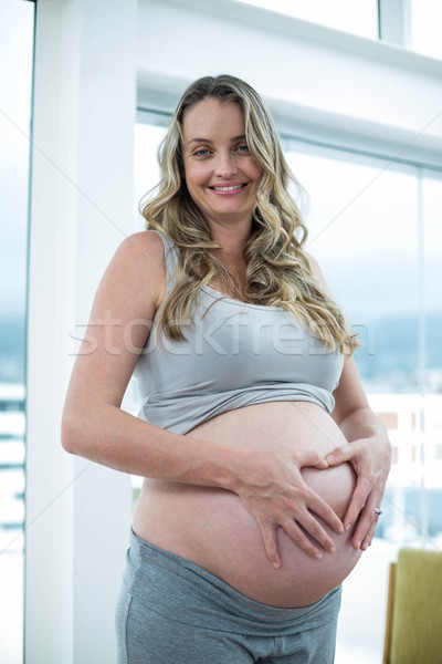 Kobieta w ciąży żołądka portret sypialni kobieta Zdjęcia stock © wavebreak_media