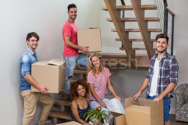 Happy young friends relocating in new house Stock photo © wavebreak_media