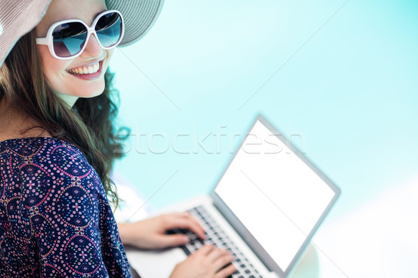 Woman using her laptop Stock photo © wavebreak_media