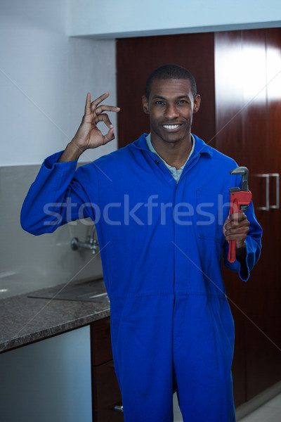 Plumber fixing the sink with wrench  Stock photo © wavebreak_media