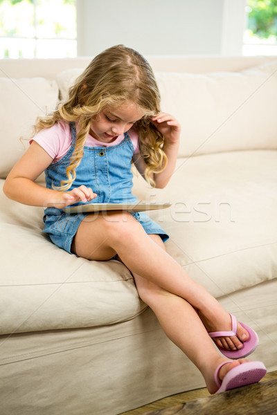 Cute girl using digital tablet Stock photo © wavebreak_media