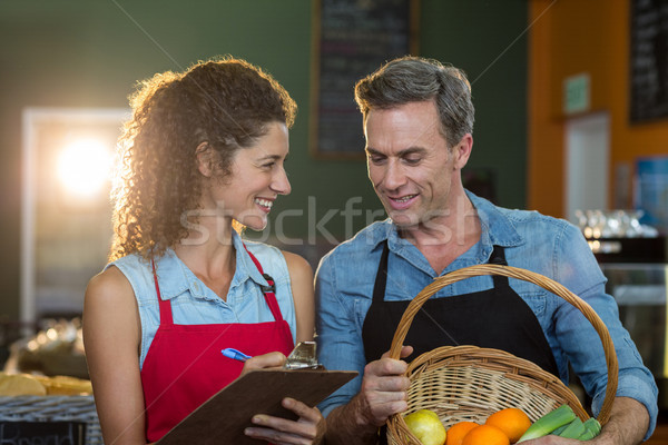 Staff members maintain records on clipboard Stock photo © wavebreak_media