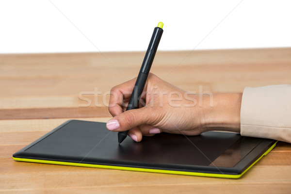Hand of graphic designer using graphic tablet Stock photo © wavebreak_media