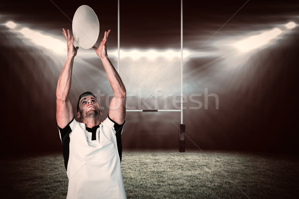 Composite image of rugby player catching the ball Stock photo © wavebreak_media