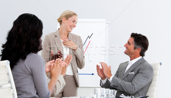 Stock photo: Smiling business people applauding a good presentation