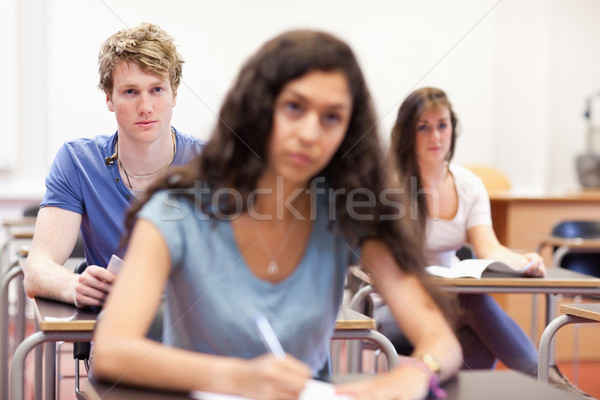 Focused students taking notes in a classroom Stock photo © wavebreak_media