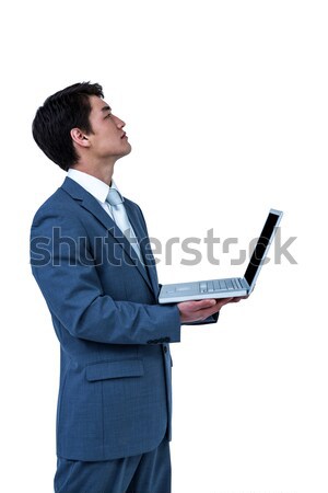 Businesswoman looking at her clipboard against a white background Stock photo © wavebreak_media
