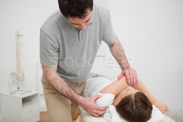 Patient lying on a medical table while being stretched in a room Stock photo © wavebreak_media